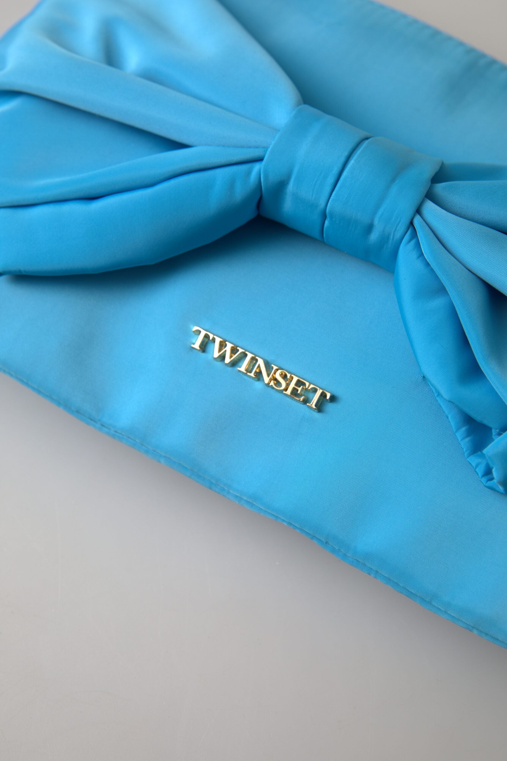 Twinset – Elegante Seidenclutch mit Schleifenakzent