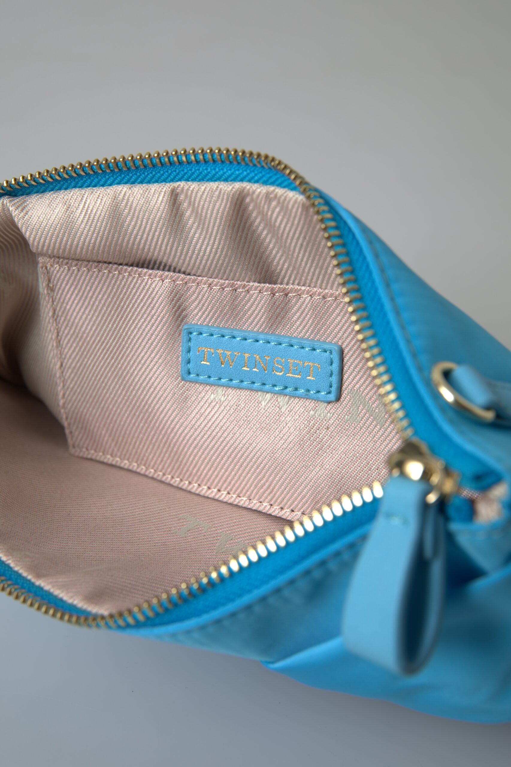 Twinset – Elegante Seidenclutch mit Schleifenakzent