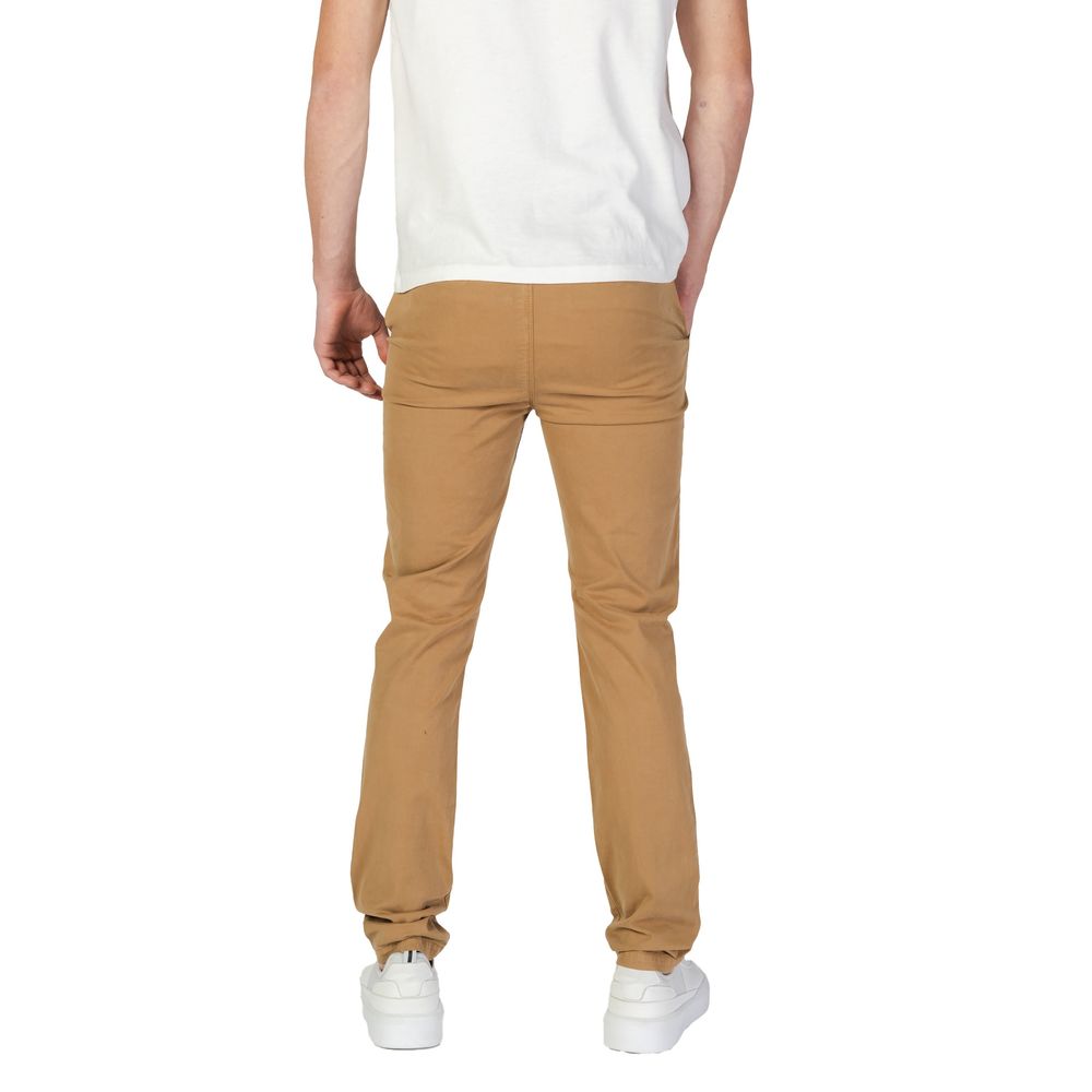 Superdry – Enge Hose aus beigefarbener Baumwolle