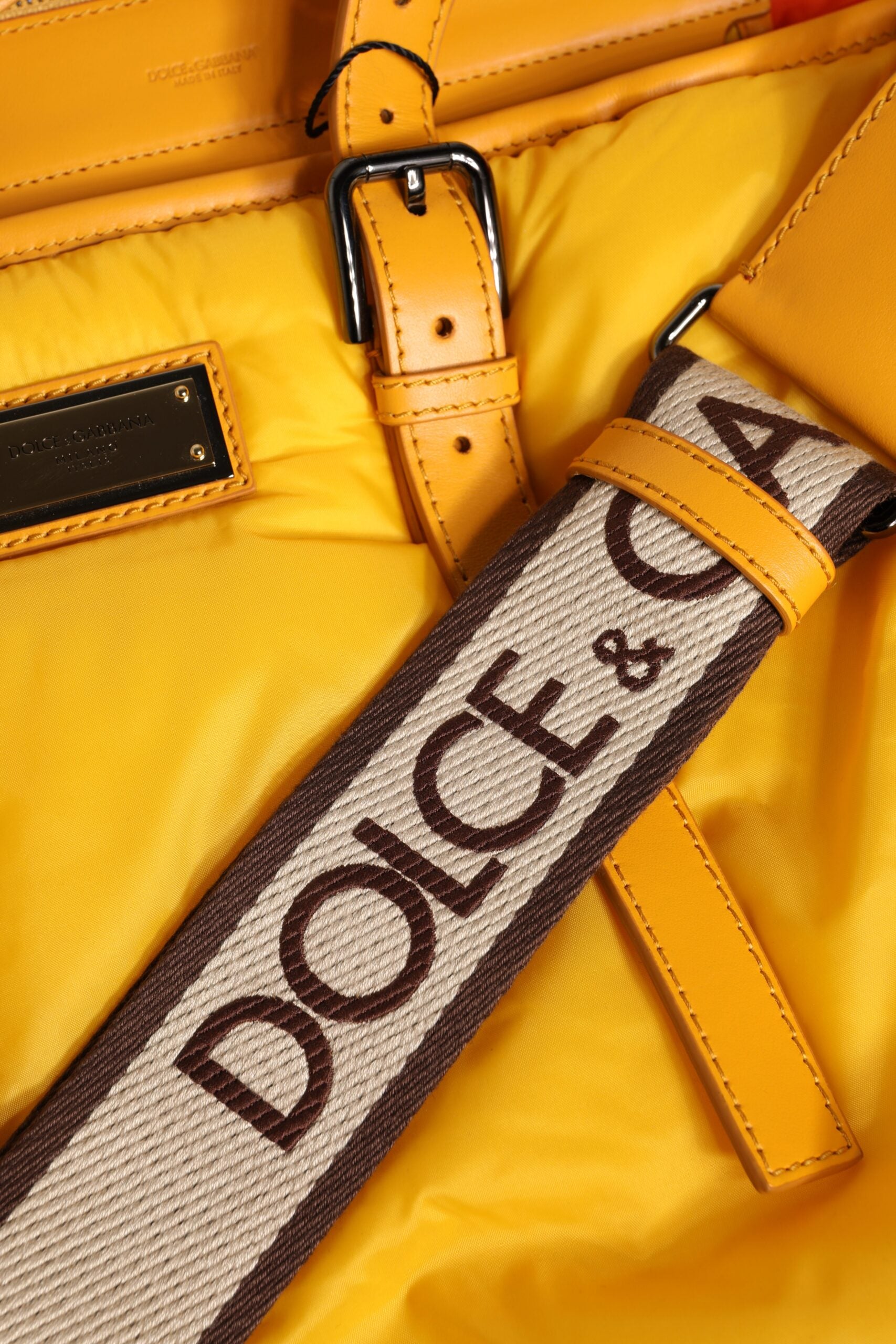 Dolce &amp; Gabbana – Gelb-orangefarbene Reisetasche aus Nylon mit Logo-Plakette